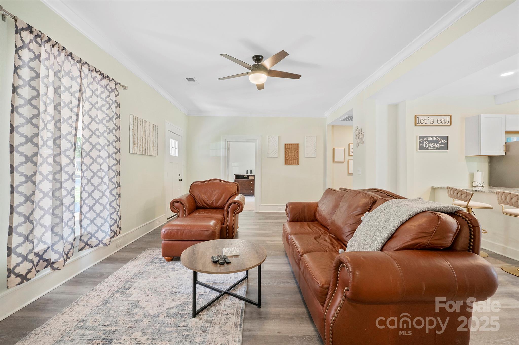 600 3rd Street Spencer, NC 28159 - Photo 10 of 27 a living room with furniture and a chandelier