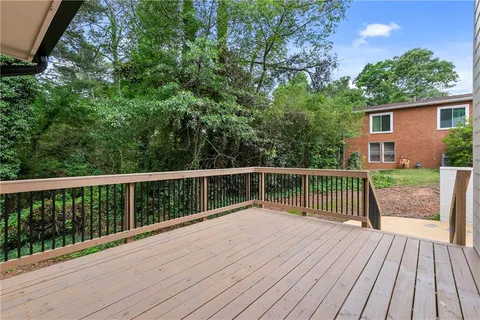 a view of balcony with wooden floor