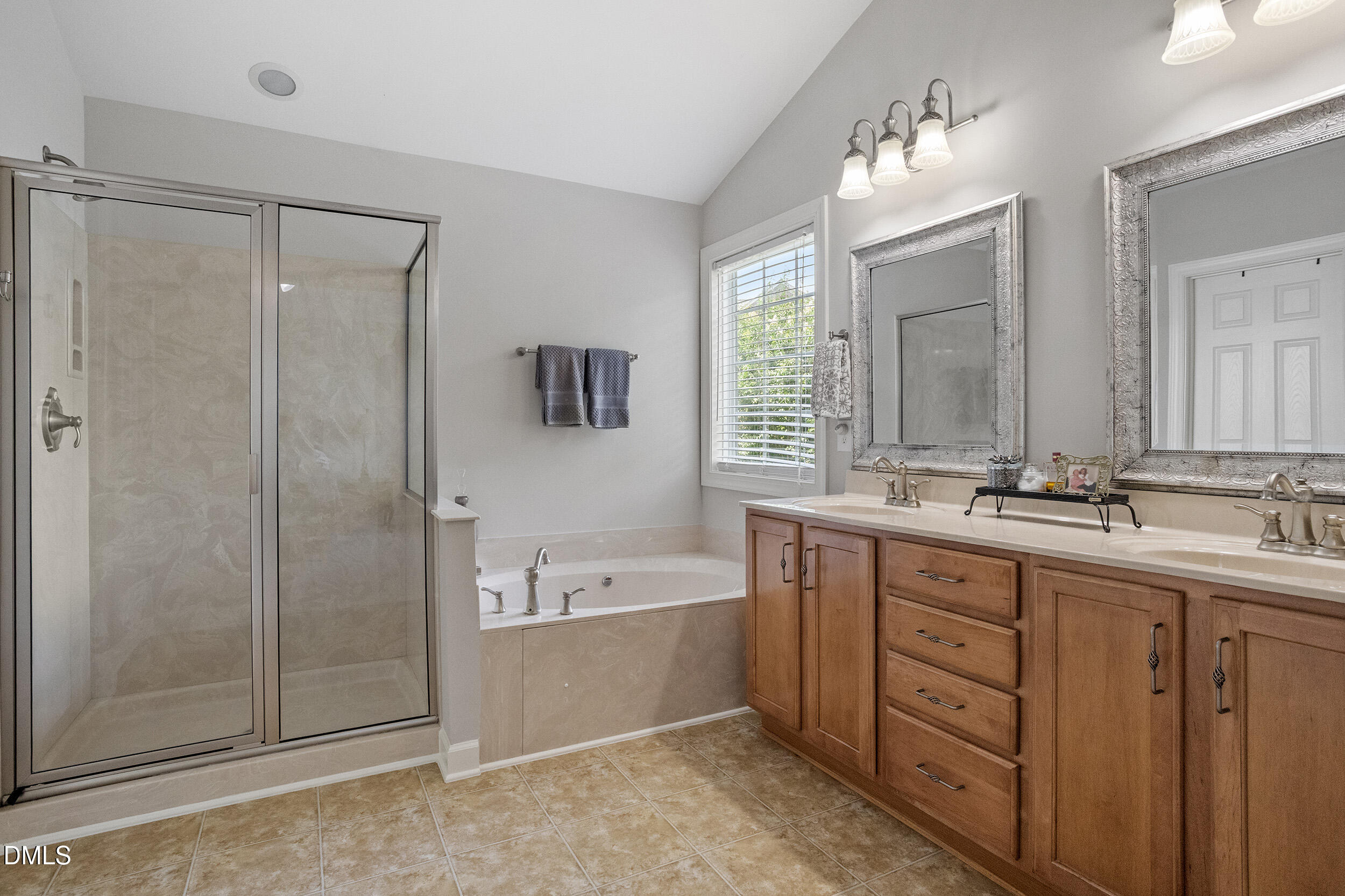 1019 Bianco Drive Raleigh, NC 27607 - Photo 22 of 29 a bathroom with a double vanity sink mirror and shower