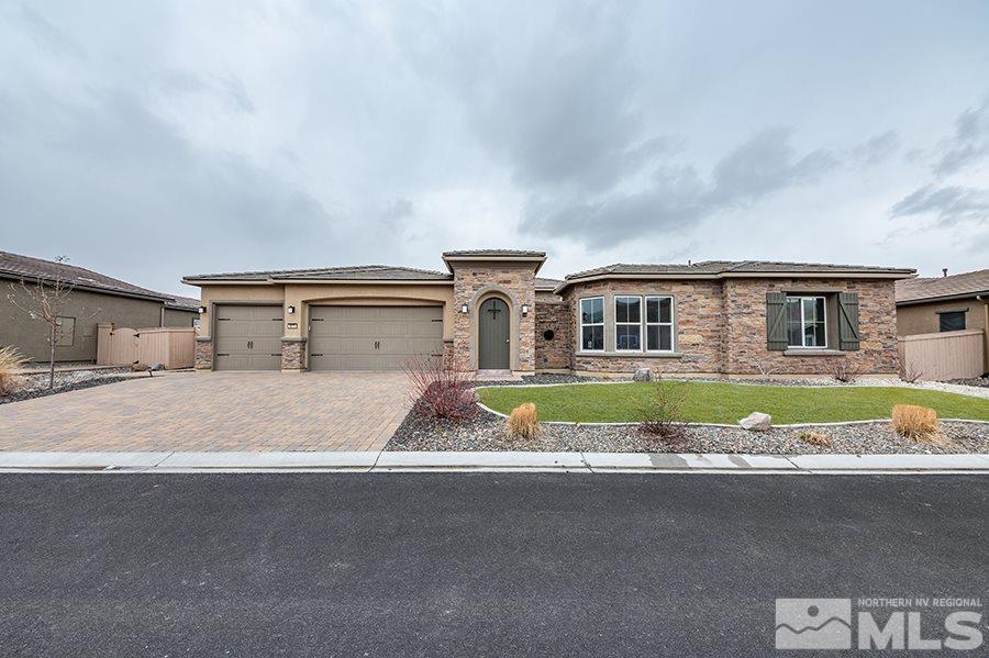 9875 Firefoot Lane Reno, NV 89521 - Photo 1 of 29 a front view of house with yard and car parked