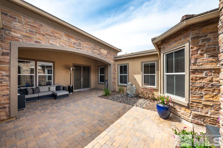 9875 Firefoot Lane Reno, NV 89521 - Photo 2 of 29 a view of a house with sitting area and furniture