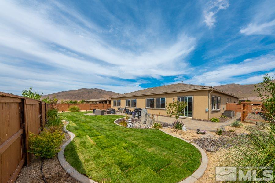 9875 Firefoot Lane Reno, NV 89521 - Photo 22 of 29 front view of house with a yard