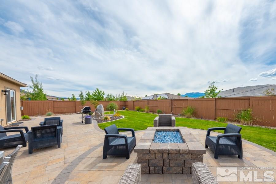 9875 Firefoot Lane Reno, NV 89521 - Photo 25 of 29 an outdoor sitting area with furniture and garden