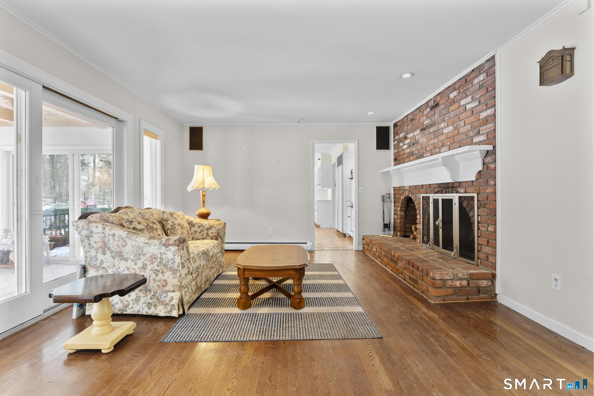 4 Twist Hill Road Newtown, CT 06470 - Photo 20 of 40 a living room with furniture and a wooden floor
