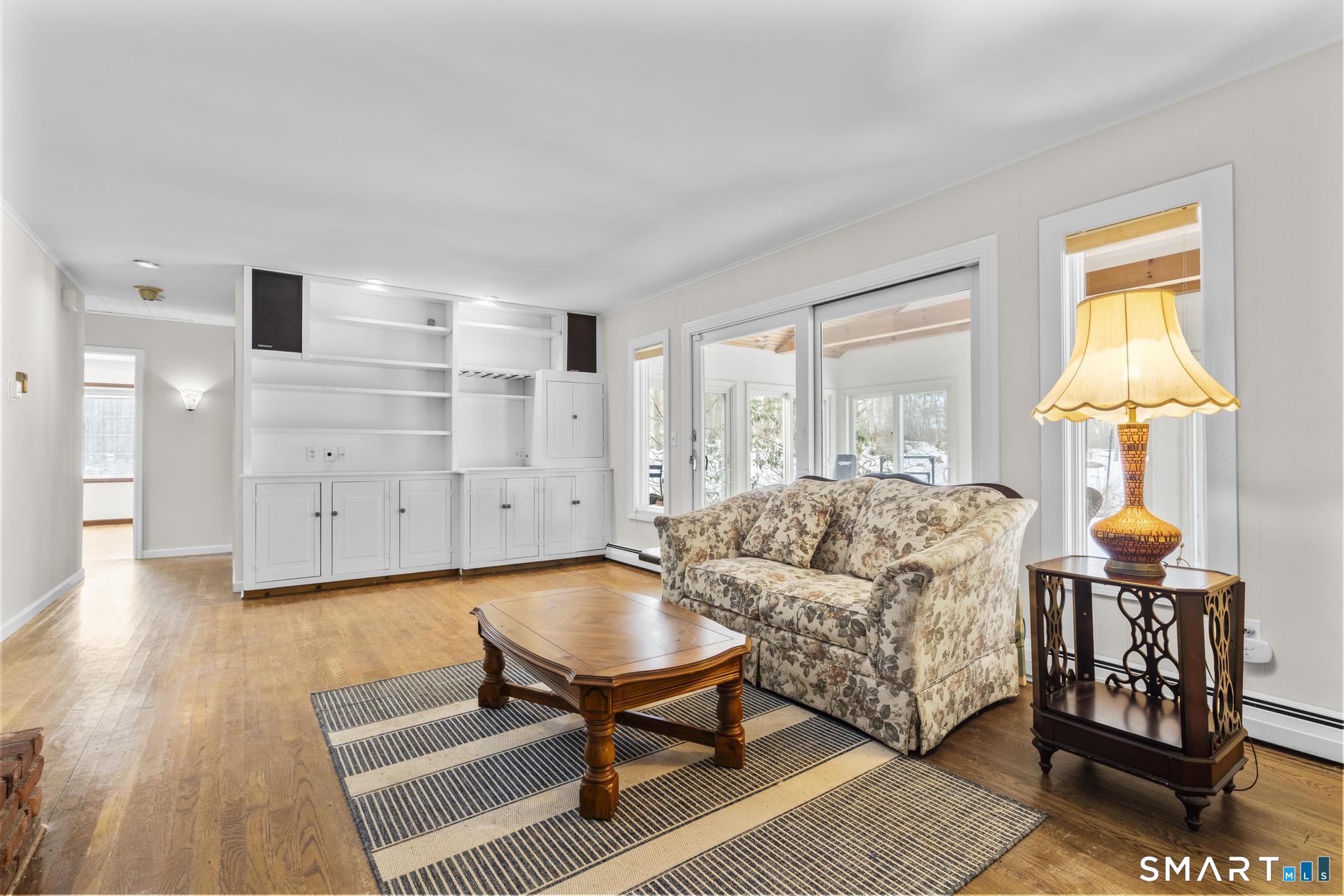 4 Twist Hill Road Newtown, CT 06470 - Photo 21 of 40 a living room with furniture and a table