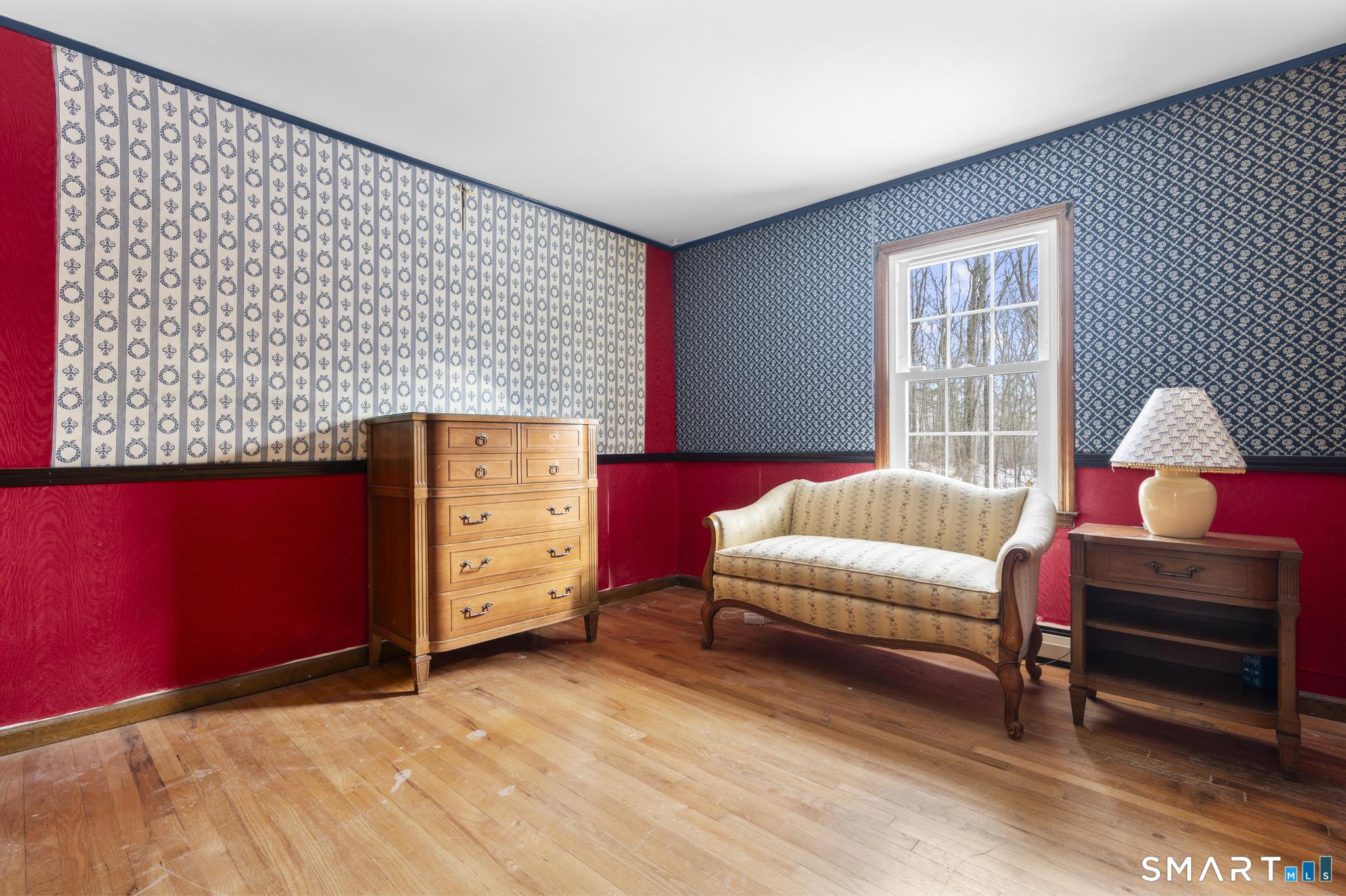 4 Twist Hill Road Newtown, CT 06470 - Photo 26 of 40 a bedroom with a bed and wooden floor