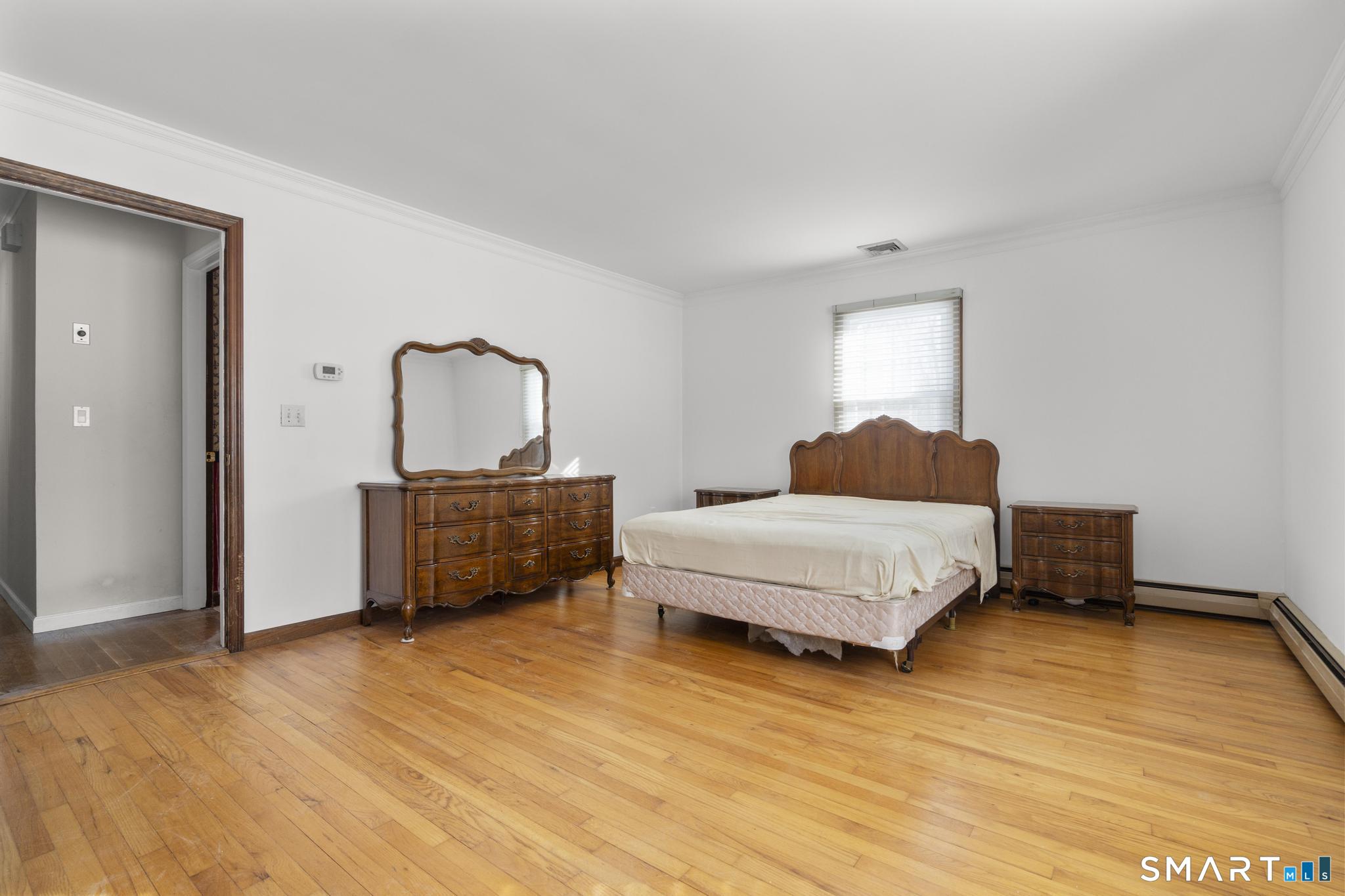 4 Twist Hill Road Newtown, CT 06470 - Photo 28 of 40 a bedroom with a bed and a dresser