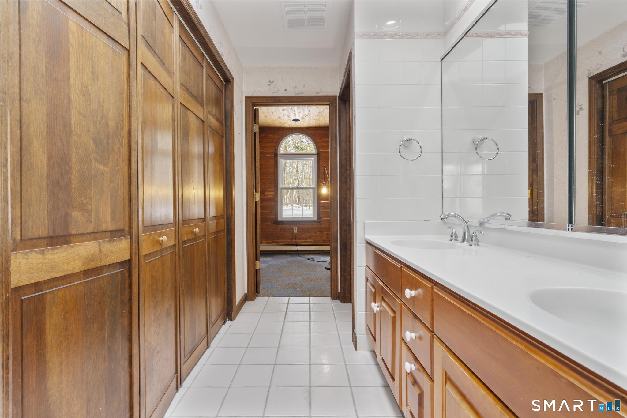 4 Twist Hill Road Newtown, CT 06470 - Photo 29 of 40 a spacious bathroom with a shower and a sink