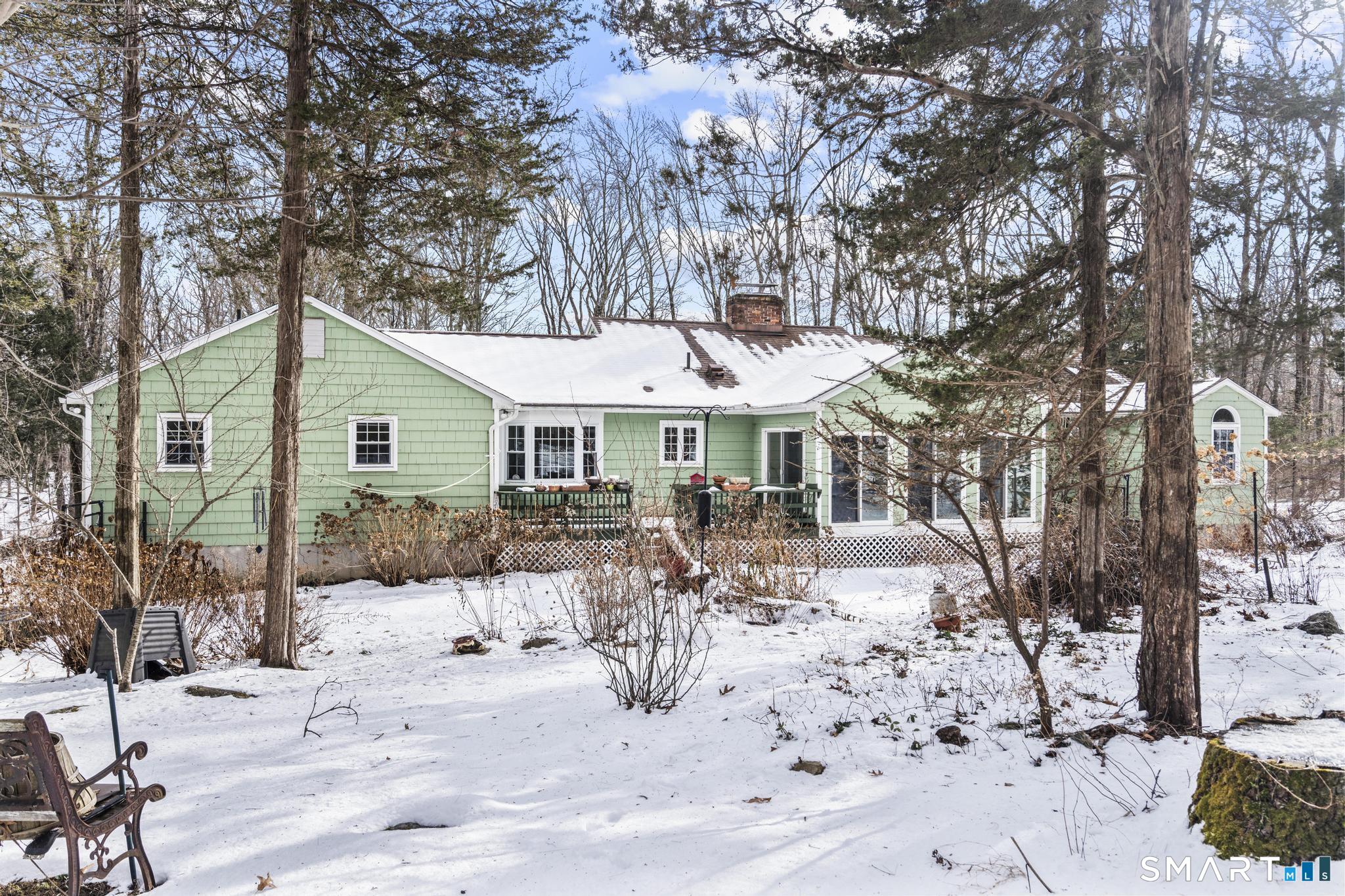 4 Twist Hill Road Newtown, CT 06470 - Photo 38 of 40 a patio with a yard and trees