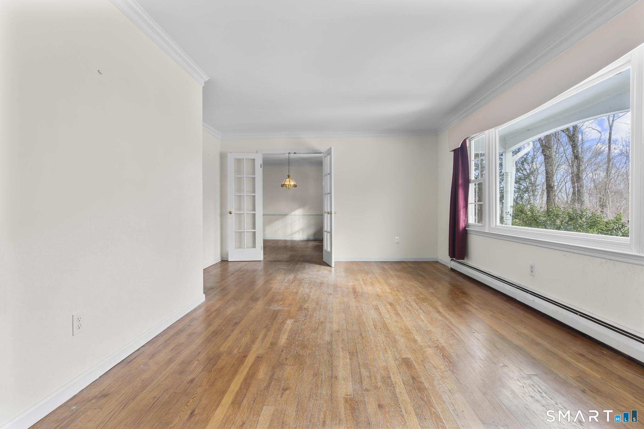 4 Twist Hill Road Newtown, CT 06470 - Photo 4 of 40 wooden floor in an empty room with a window