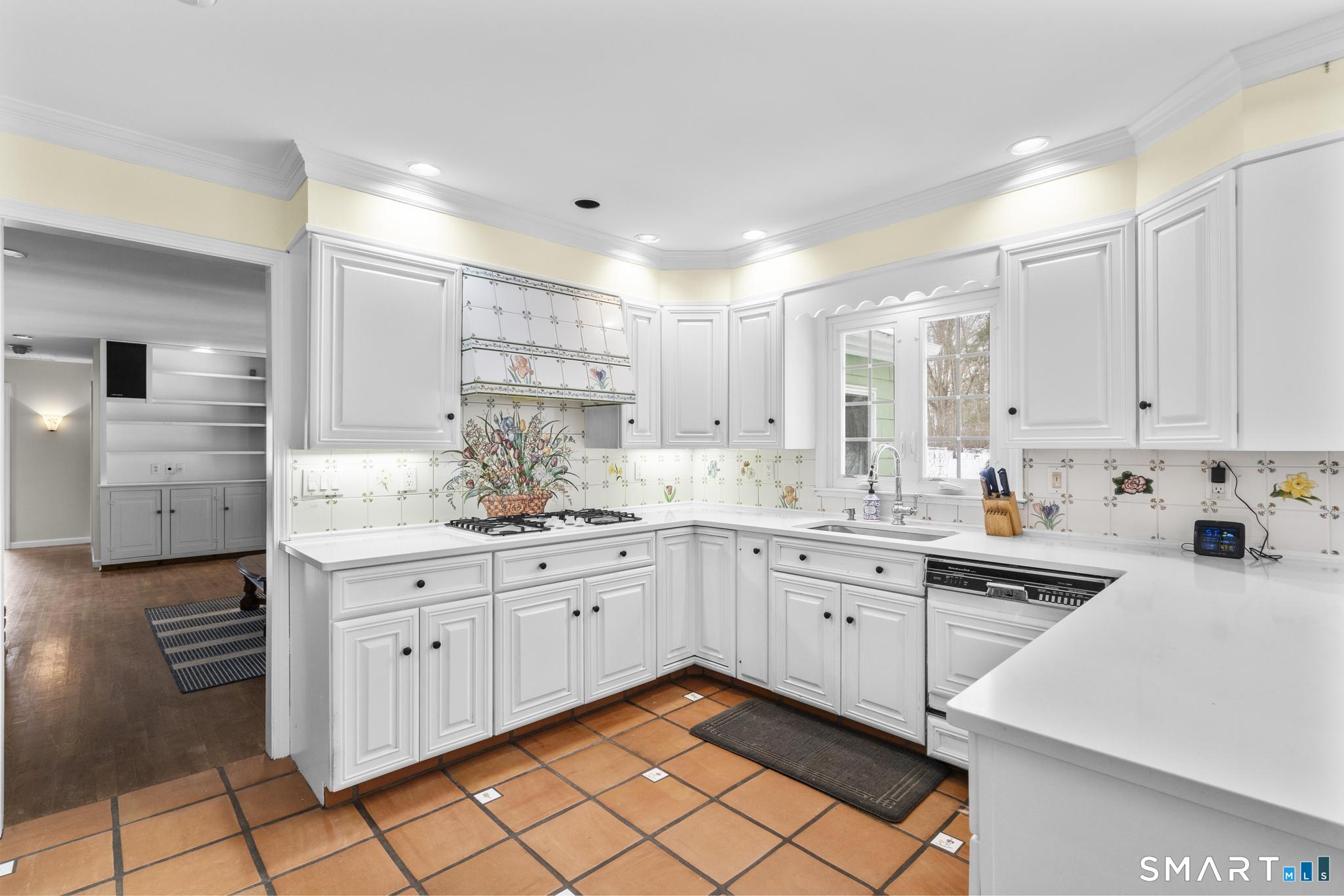 4 Twist Hill Road Newtown, CT 06470 - Photo 9 of 40 a kitchen with stainless steel appliances granite countertop a sink and cabinets