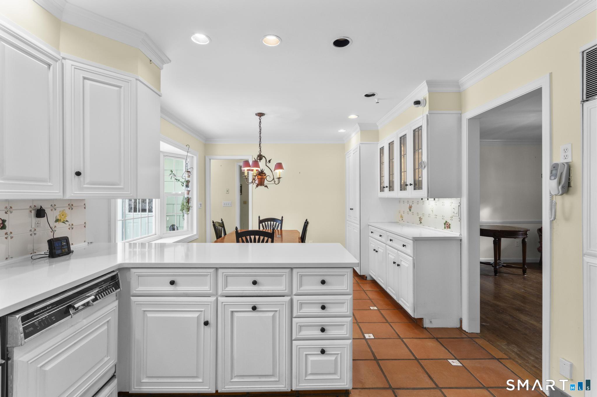 4 Twist Hill Road Newtown, CT 06470 - Photo 10 of 40 a kitchen with white cabinets and sink