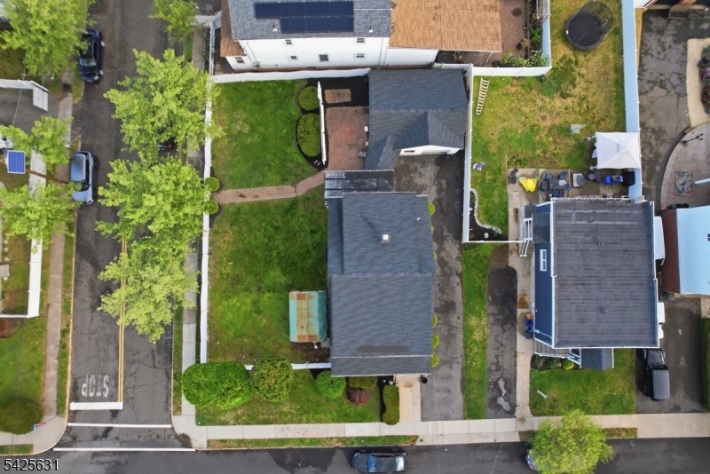 60 Westervelt Place Lodi, NJ 07644 - Photo 3 of 48 aerial view of a house with a garden and plants