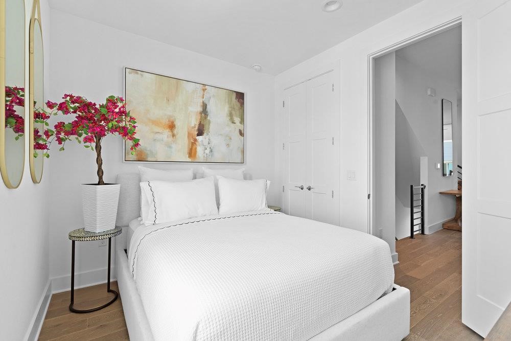 2805 McCurdy Street, Unit 7 Austin, TX 78723 - Photo 25 of 40 a bed room with a bed and a painting on the wall