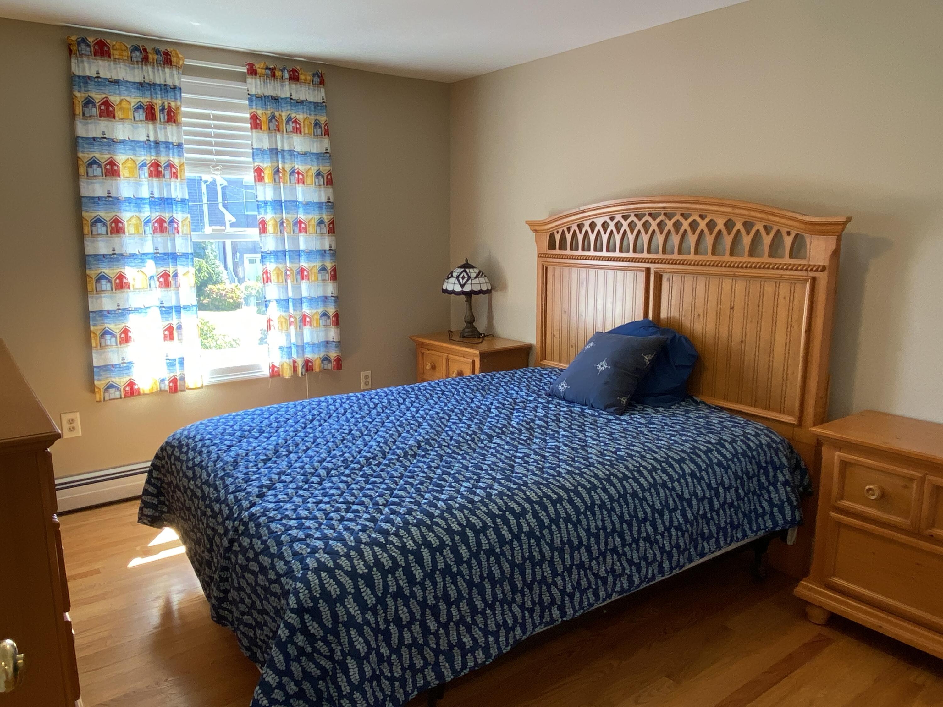 25 Ripple Cove Road Hyannis, MA 02601 - Photo 13 of 38 a bedroom with a bed and a book shelf