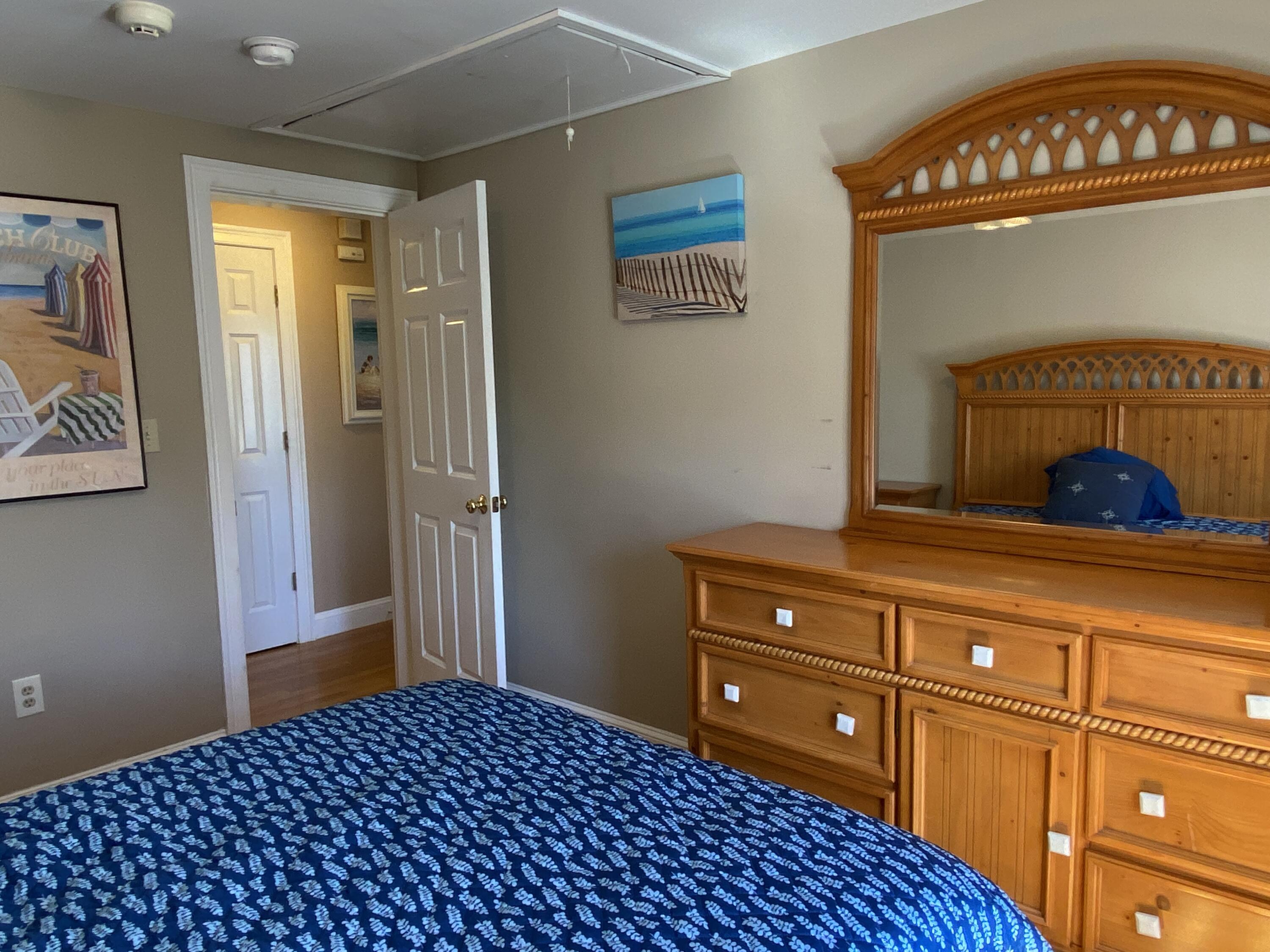 25 Ripple Cove Road Hyannis, MA 02601 - Photo 14 of 38 a bedroom with a bed and a cabinets