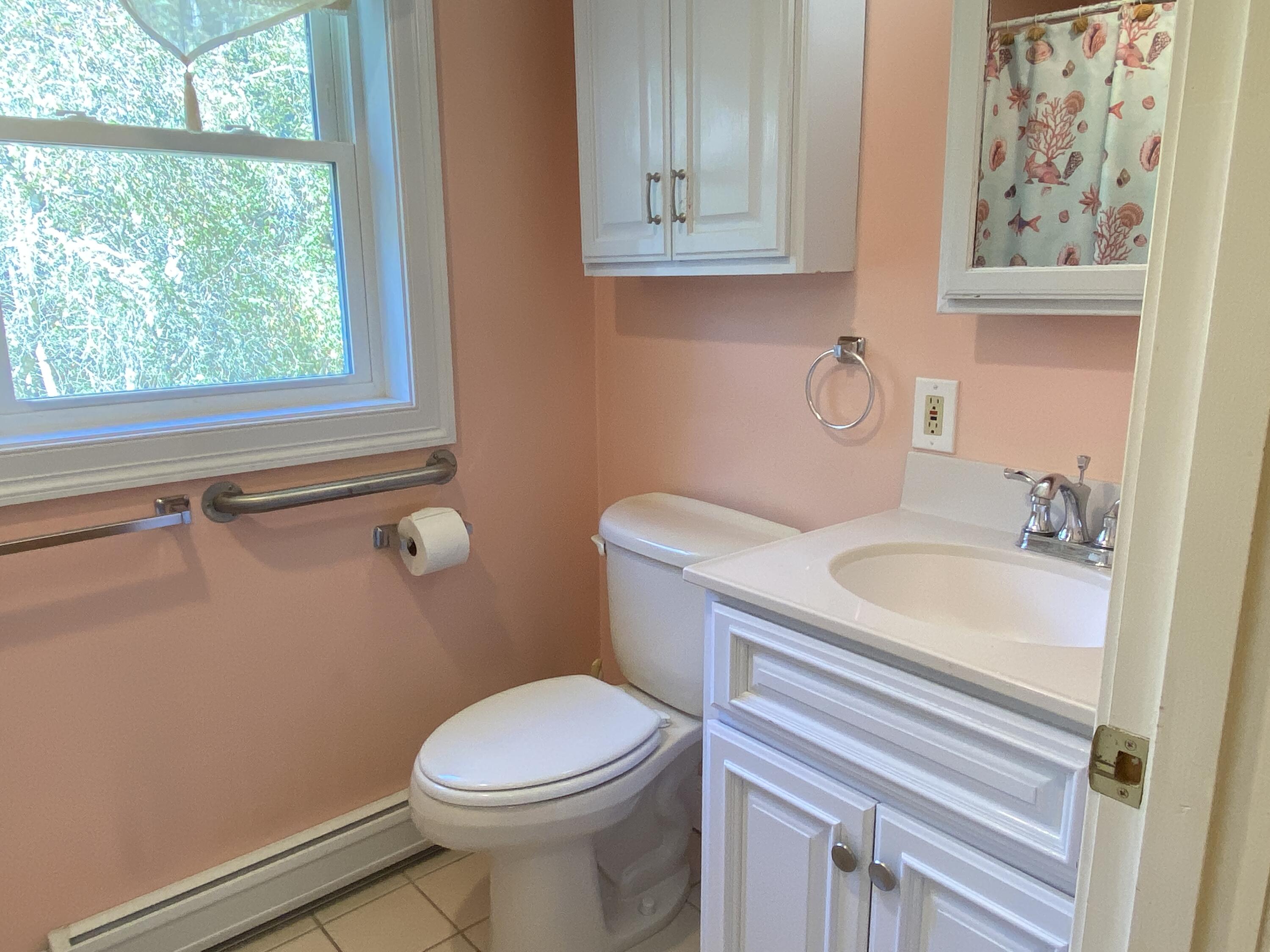25 Ripple Cove Road Hyannis, MA 02601 - Photo 15 of 38 a bathroom with a sink a toilet and a window