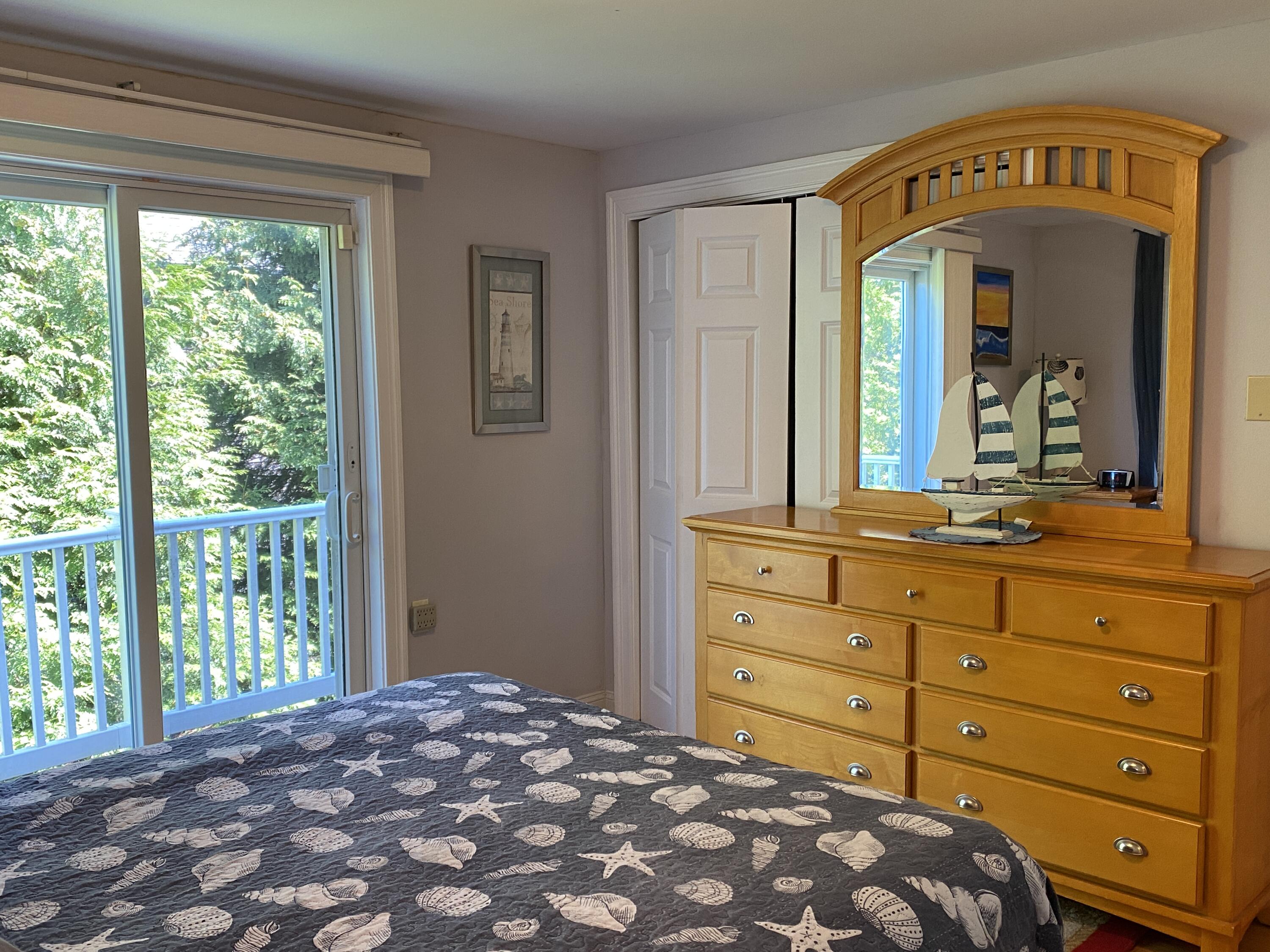 25 Ripple Cove Road Hyannis, MA 02601 - Photo 17 of 38 a bedroom with a bed and a large dresser