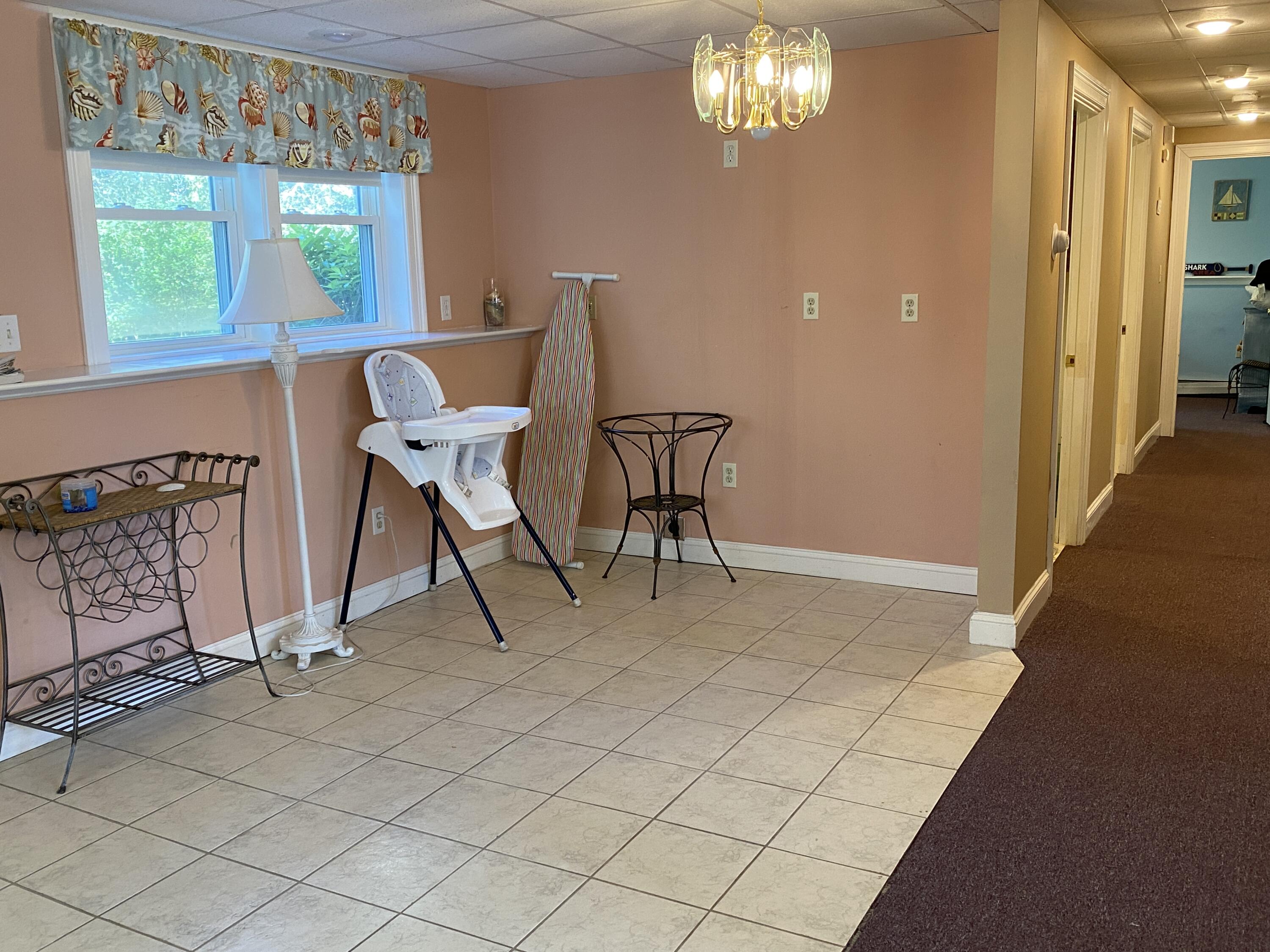 25 Ripple Cove Road Hyannis, MA 02601 - Photo 26 of 38 a view of a dining room with furniture a chandelier and wooden floor