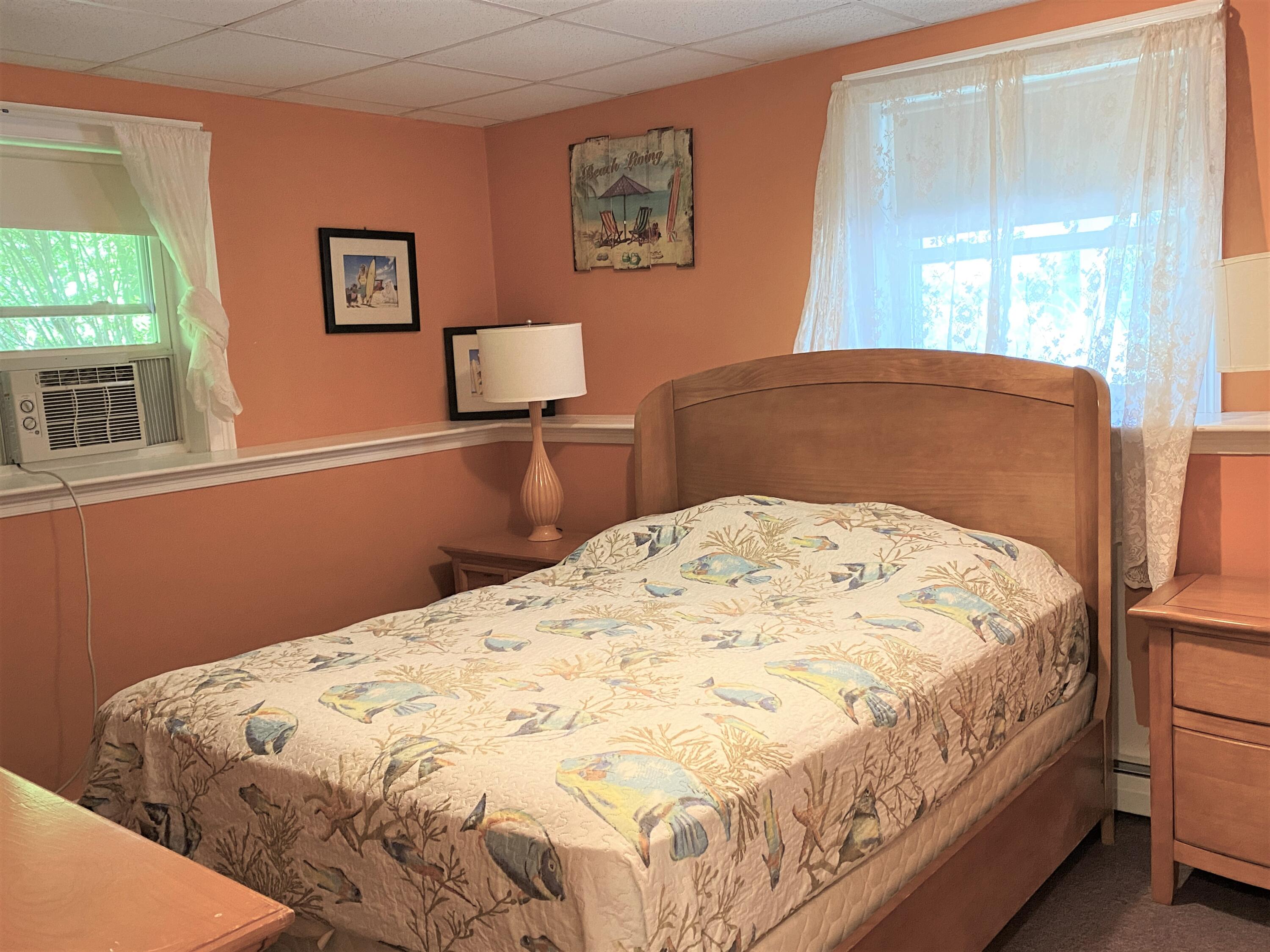 25 Ripple Cove Road Hyannis, MA 02601 - Photo 28 of 38 a bed sitting in a bedroom next to a window