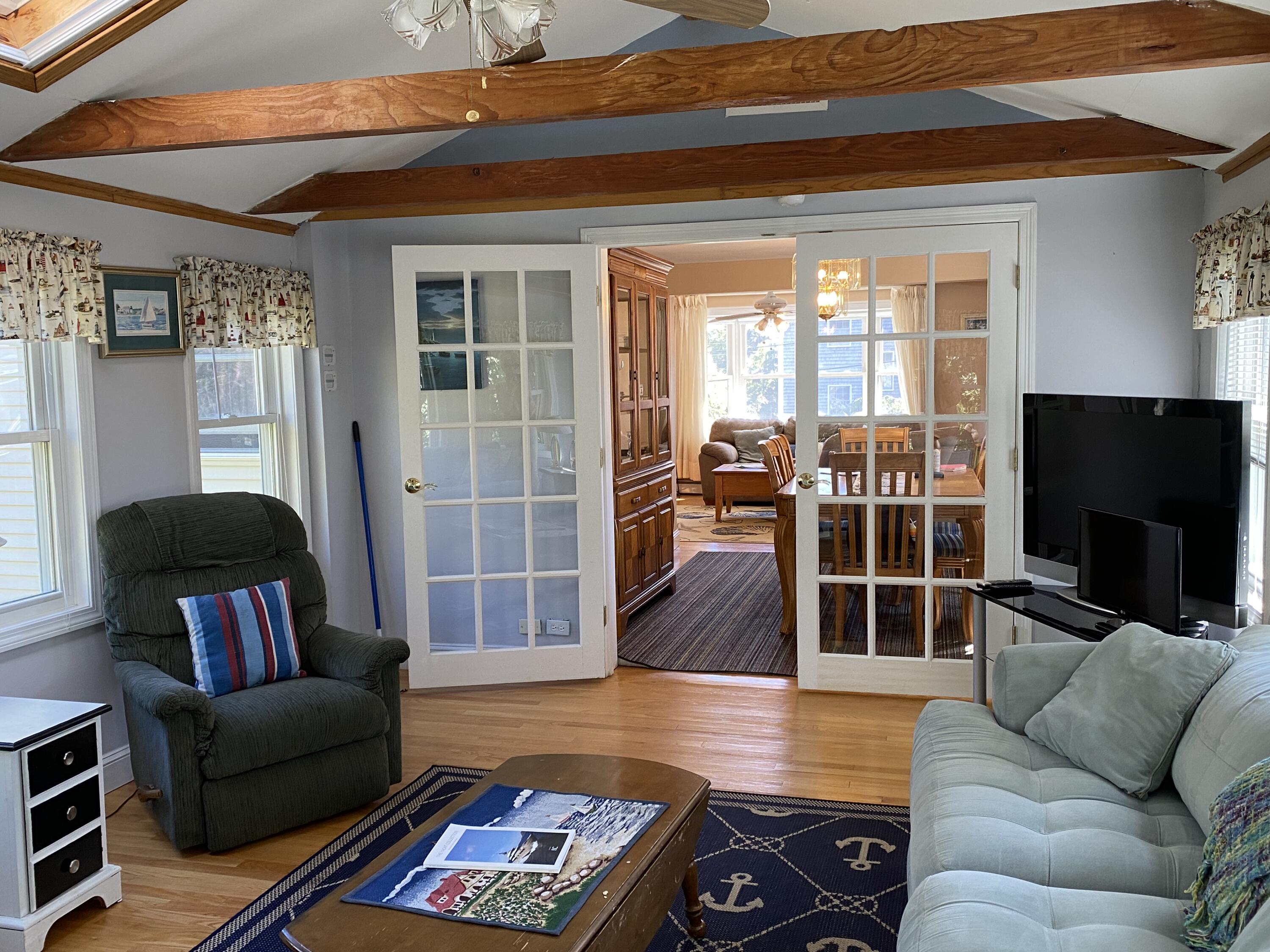 25 Ripple Cove Road Hyannis, MA 02601 - Photo 8 of 38 a living room with furniture and a flat screen tv