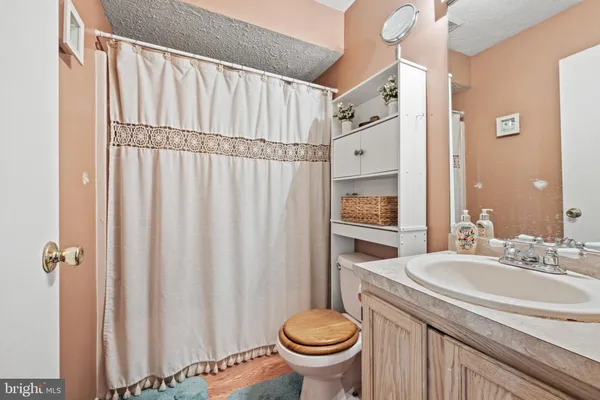 a bedroom with a bed and a ceiling fan