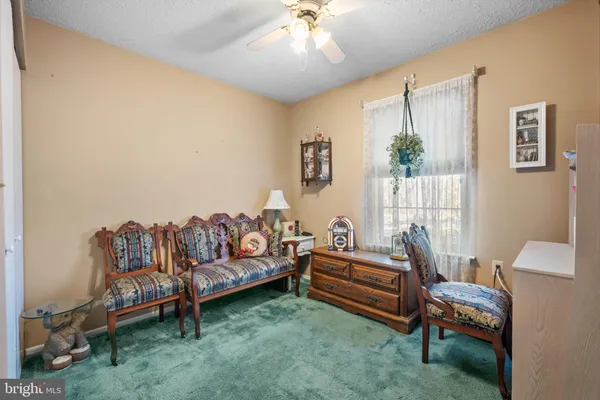 a view of a livingroom with furniture and wooden floor