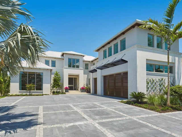 a view of a building with a yard