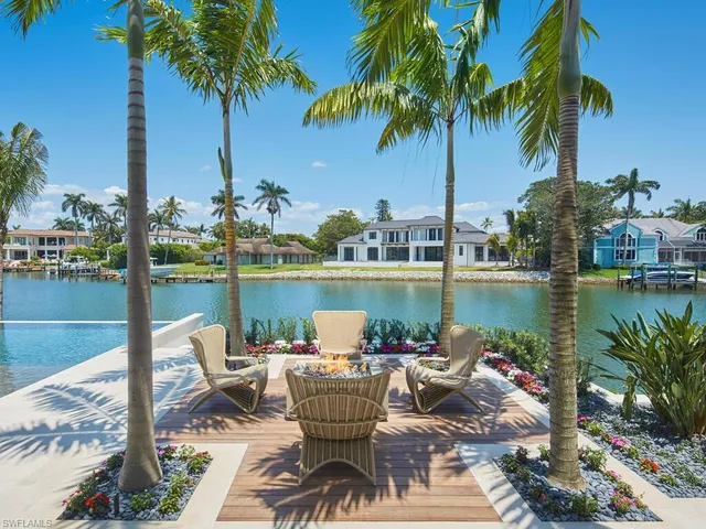 a view of a swimming pool with a lounge chairs
