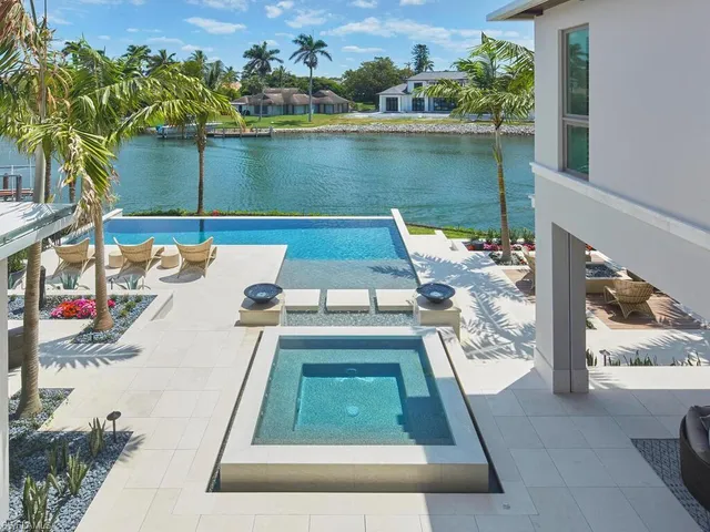 a front view of house with yard and outdoor seating