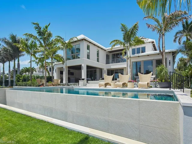 a view of a lake with houses in the back