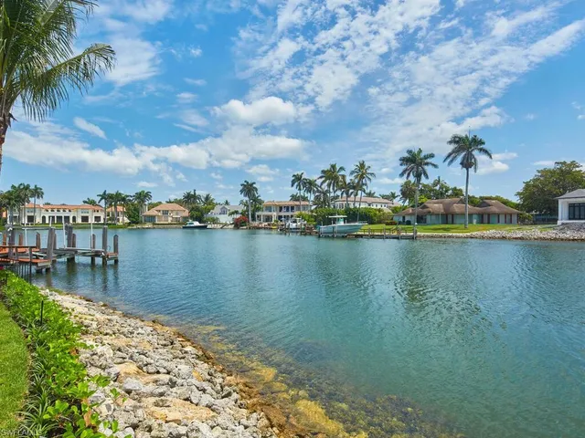 a view of a house with swimming pool and a yard