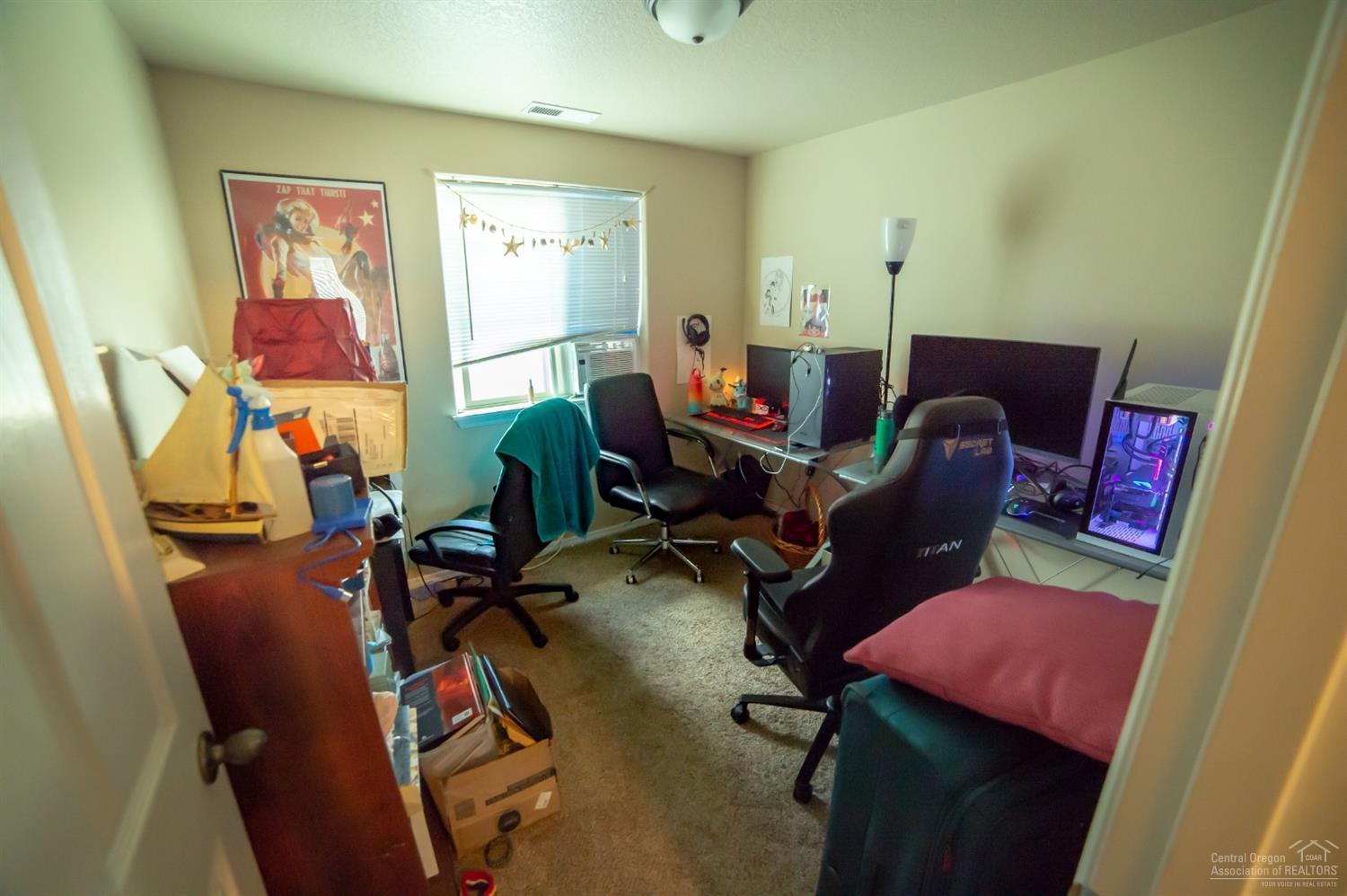 63287 Vogt Road Bend, OR 97701 - Photo 11 of 16 a view of a workspace with furniture and a window