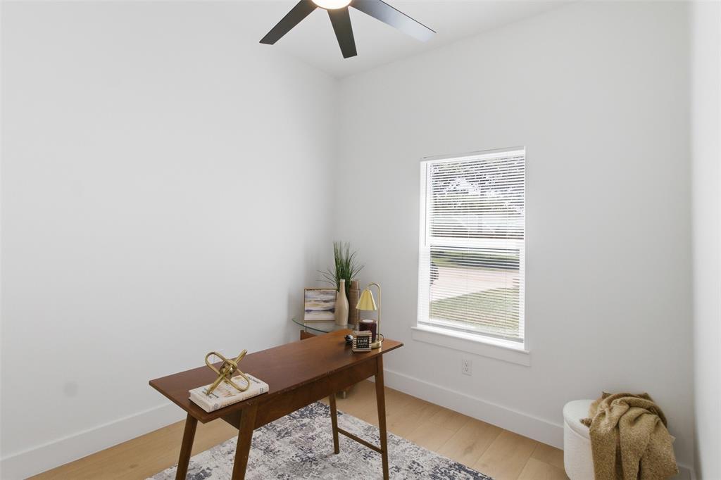 435 Waterboard Road Trinidad, TX 75163 - Photo 22 of 39 Bright room featuring a single window with blinds, light wood-finish flooring, white walls, and a ceiling fan