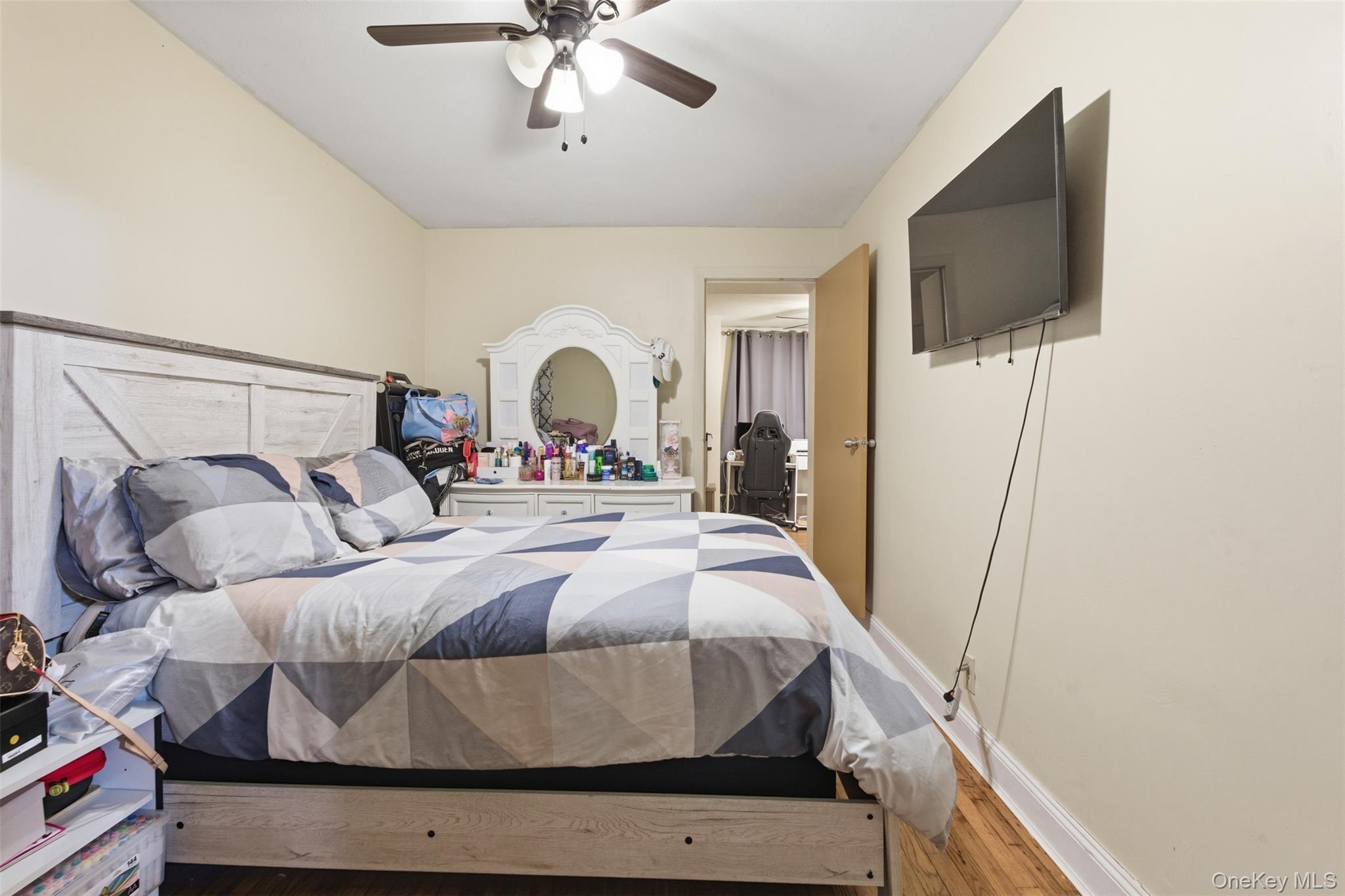 1408 Astor Avenue Bronx, NY 10469 - Photo 16 of 21 2nd Unit 1st Bedroom featuring ceiling fan and wood finished floors