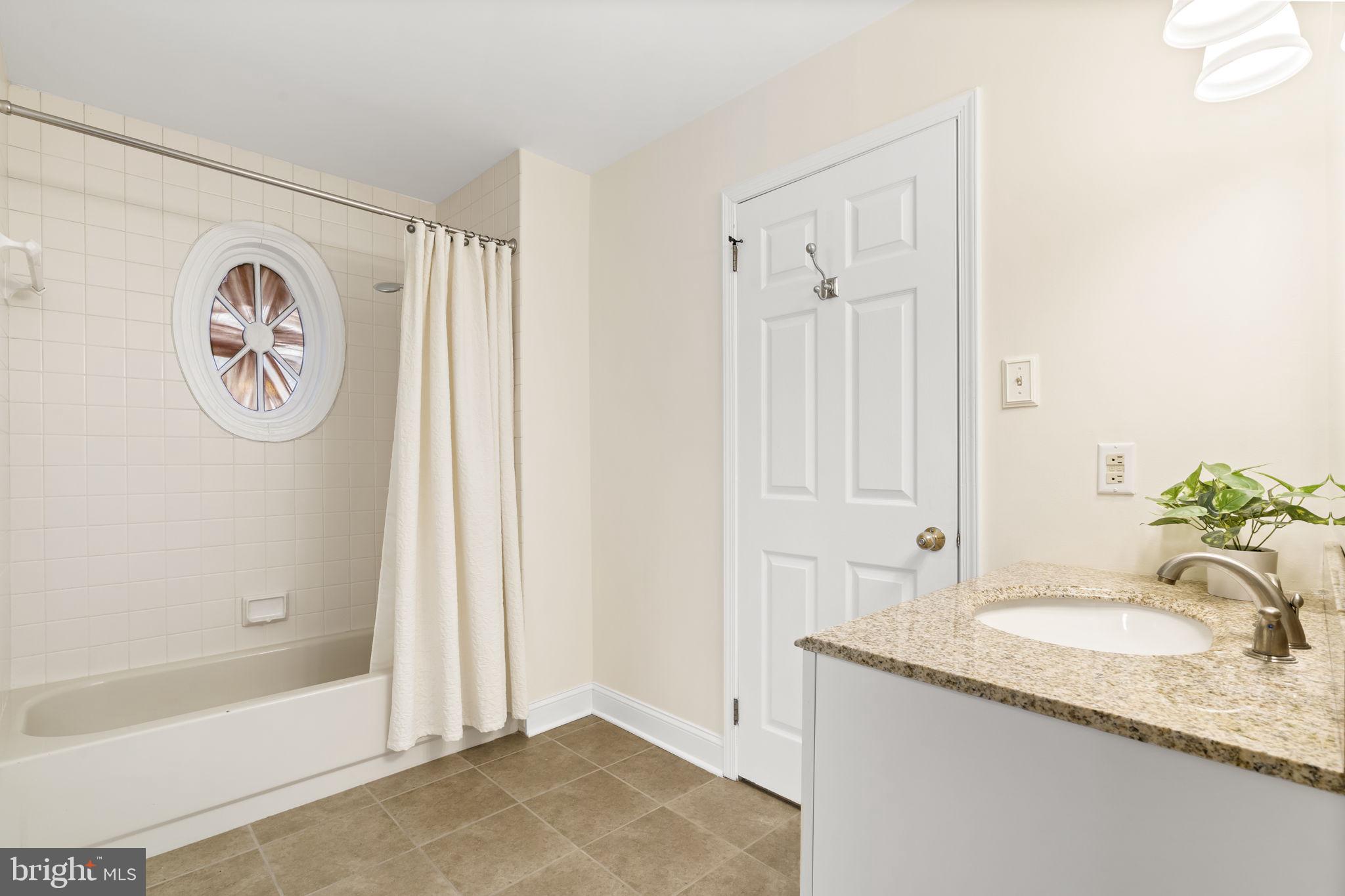 69 Main Street Chesterbrook, PA 19087 - Photo 16 of 49 Spacious bathroom with stained glass window