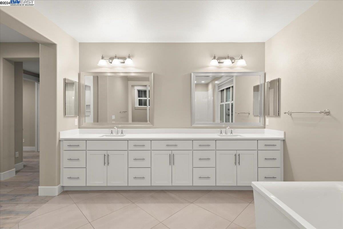 2969 Delamar Drive Dublin, CA 94568 - Photo 11 of 27 a spacious bathroom with a granite countertop sink double and mirror