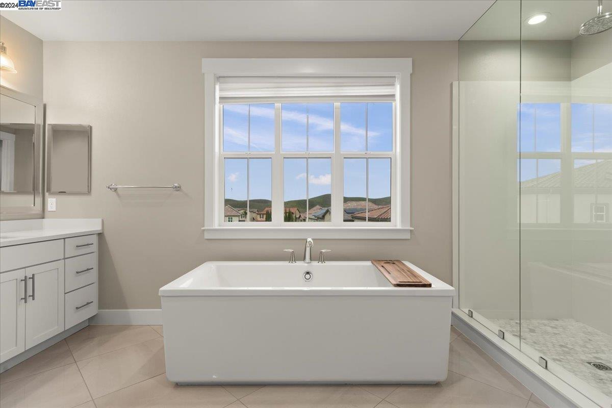 2969 Delamar Drive Dublin, CA 94568 - Photo 13 of 27 a bath tub sitting in a bathroom next to a window