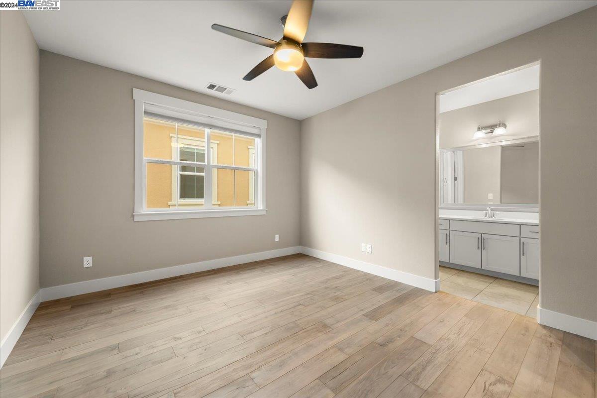 2969 Delamar Drive Dublin, CA 94568 - Photo 15 of 27 a view of an empty room with a window and wooden floor