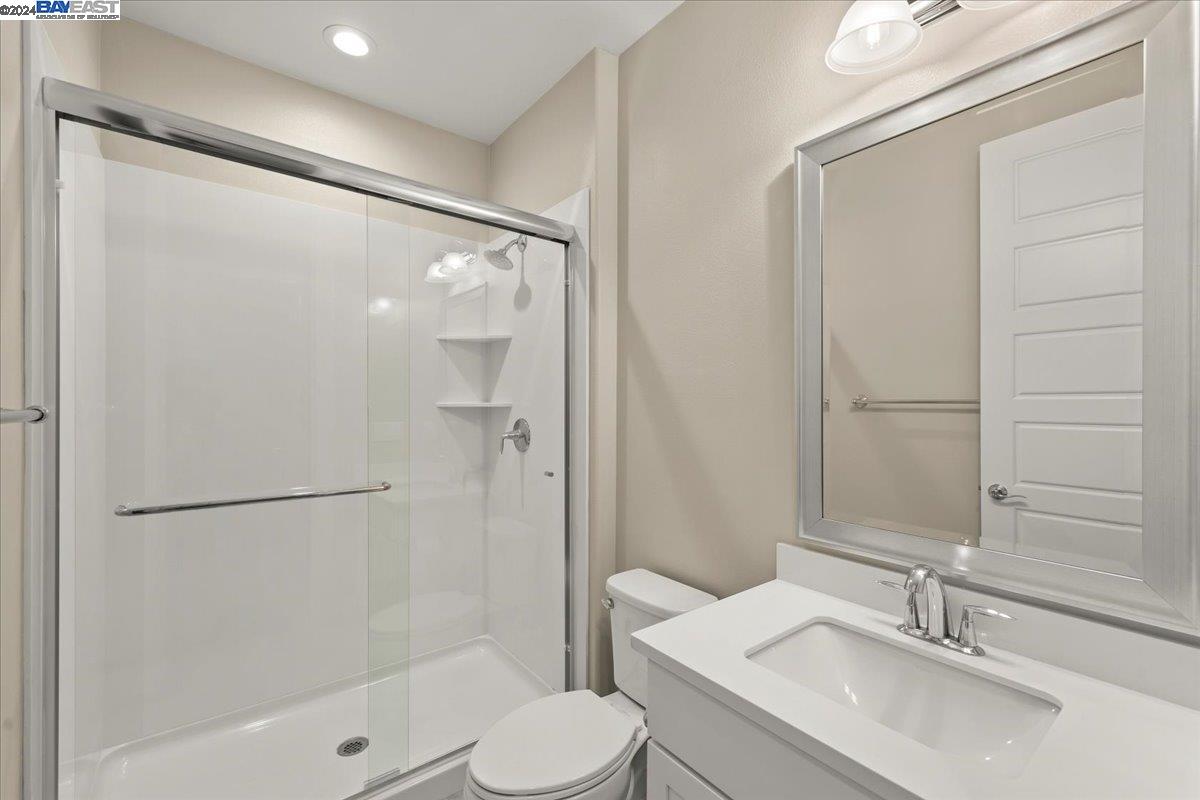 2969 Delamar Drive Dublin, CA 94568 - Photo 18 of 27 a bathroom with a sink toilet and shower