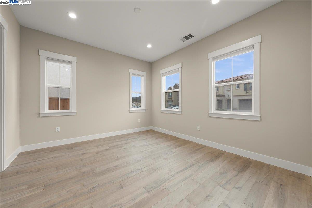 2969 Delamar Drive Dublin, CA 94568 - Photo 21 of 27 a view of an empty room with a window and wooden floor