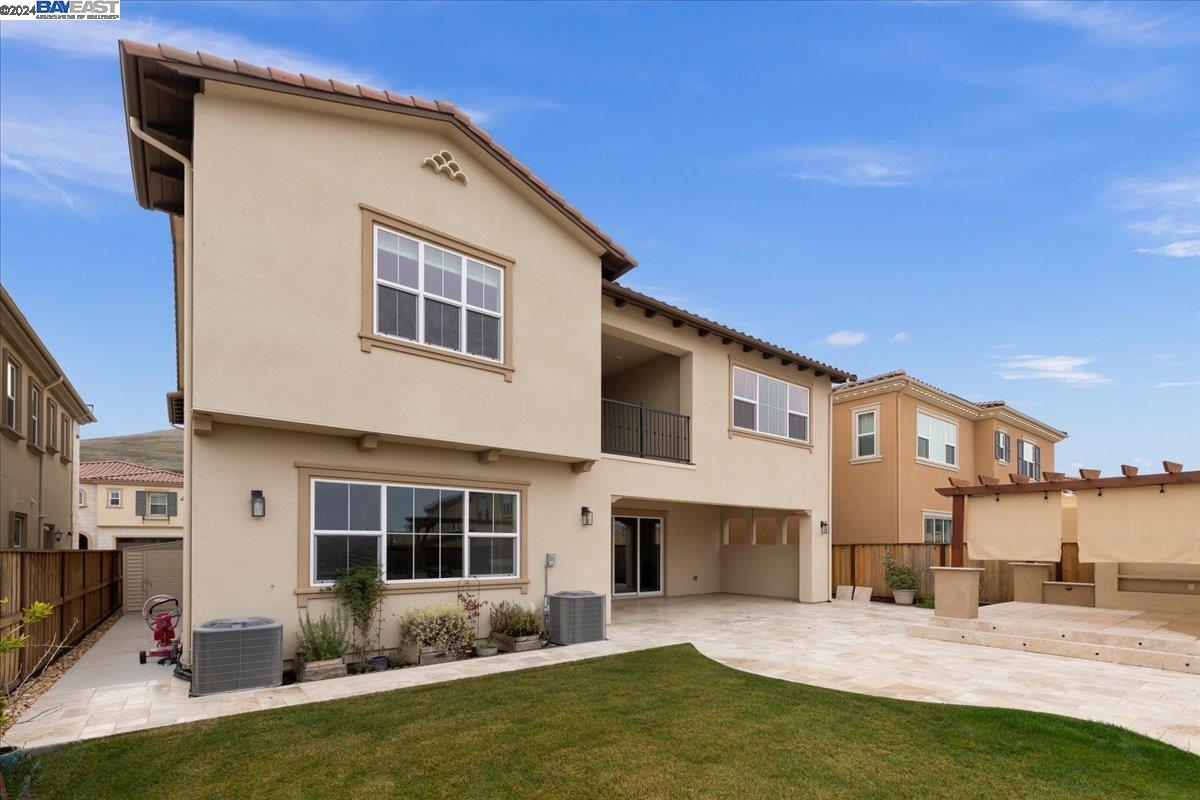 2969 Delamar Drive Dublin, CA 94568 - Photo 27 of 27 a front view of a house with a yard patio and fire pit