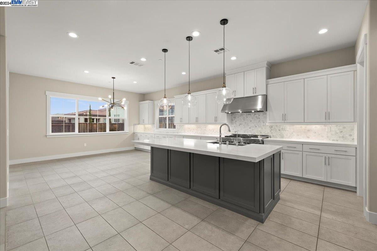 2969 Delamar Drive Dublin, CA 94568 - Photo 3 of 27 a kitchen with a sink window and cabinets