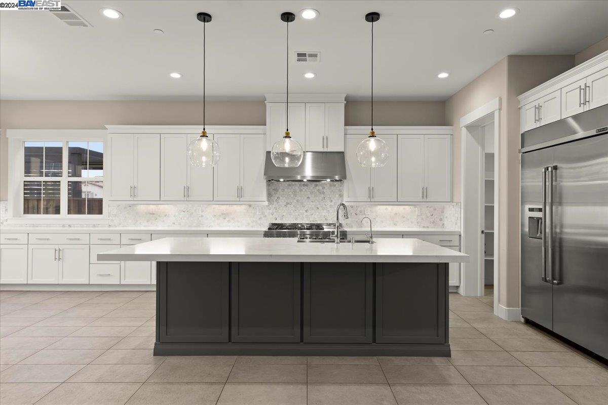 2969 Delamar Drive Dublin, CA 94568 - Photo 4 of 27 a kitchen with a sink refrigerator and cabinets