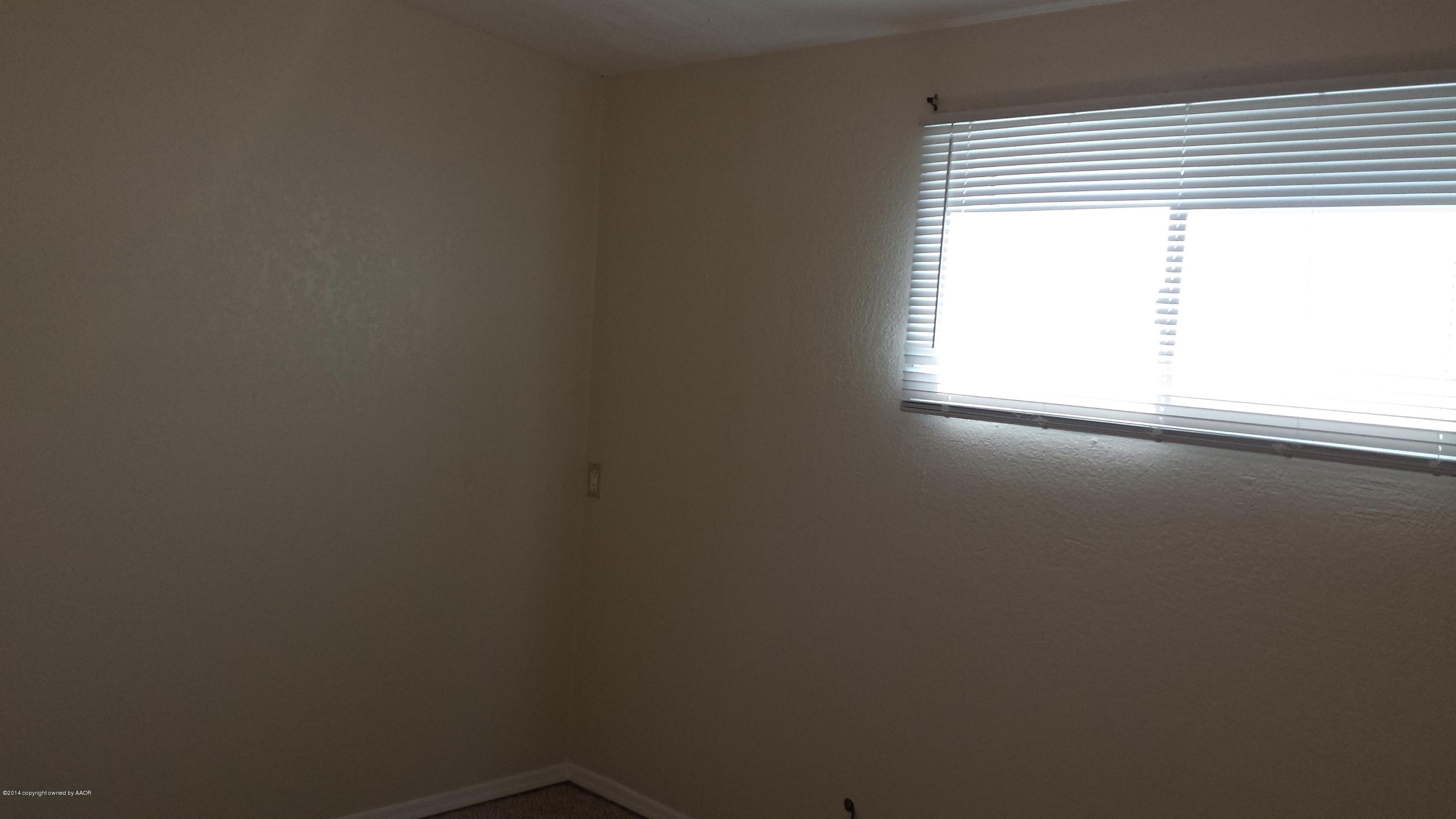 4420 South Hayden Street Amarillo, TX 79110 - Photo 13 of 16 an empty room with a window