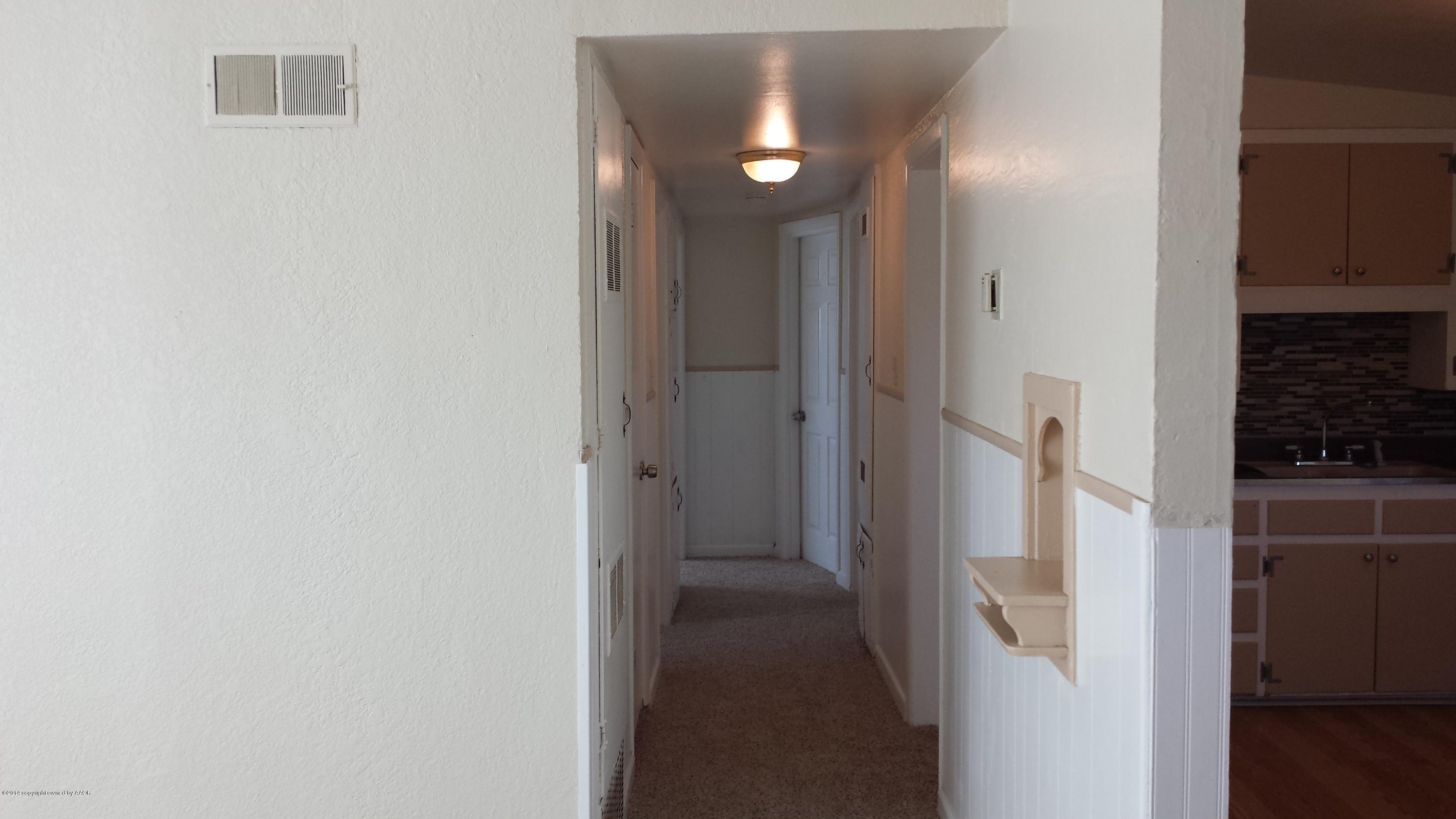 4420 South Hayden Street Amarillo, TX 79110 - Photo 15 of 16 a view of a bathroom from a hallway