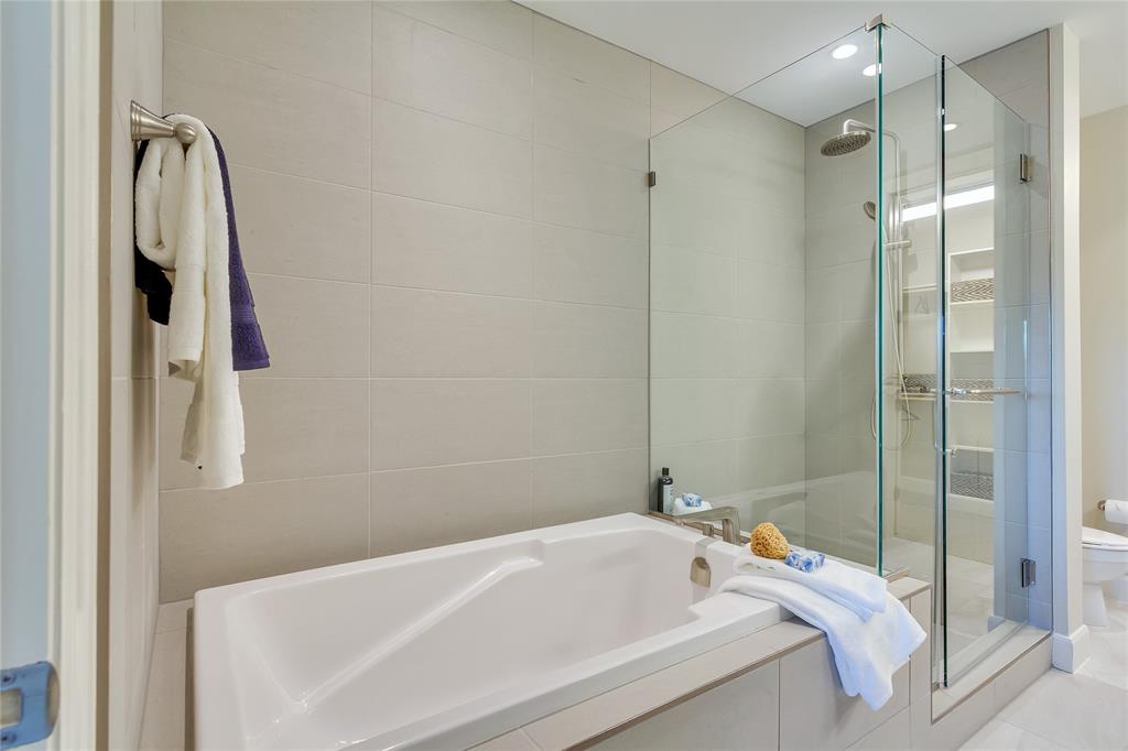4719 Cole Avenue, Unit 708 Dallas, TX 75205 - Photo 14 of 35 a bathroom with a tub and a shower