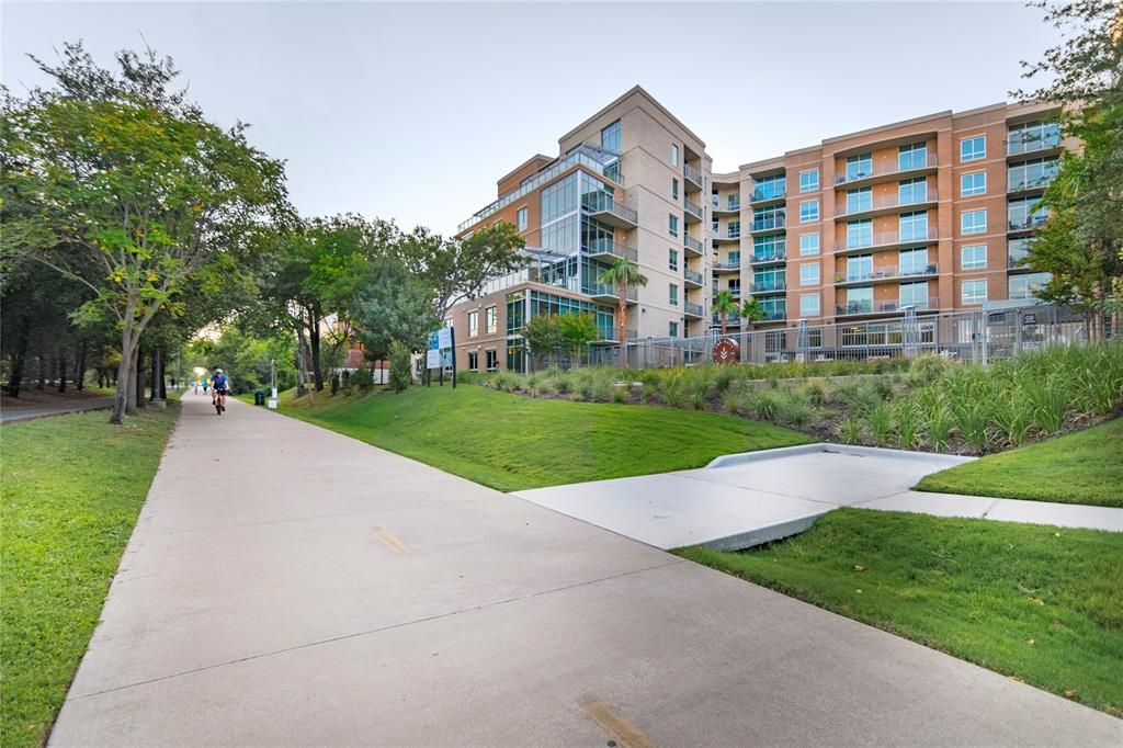 4719 Cole Avenue, Unit 708 Dallas, TX 75205 - Photo 33 of 35 a view of a building with a yard