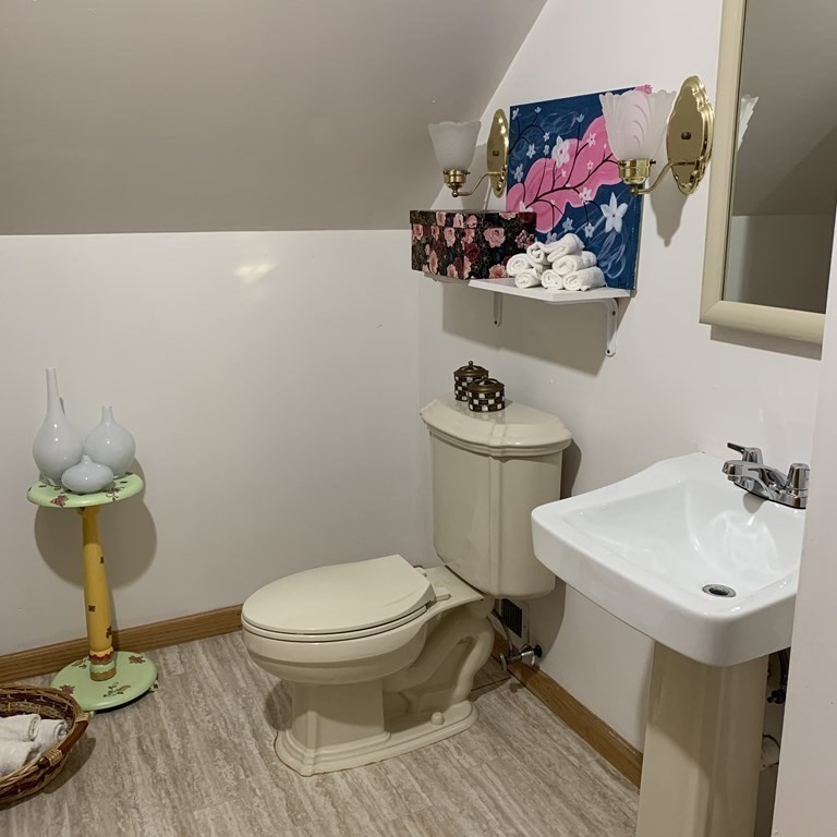23 Notre Dame Street Springfield, MA 01104 - Photo 22 of 28 a bathroom with a sink toilet and a mirror