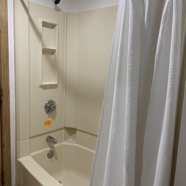 23 Notre Dame Street Springfield, MA 01104 - Photo 23 of 28 a bathroom with a sink and a window